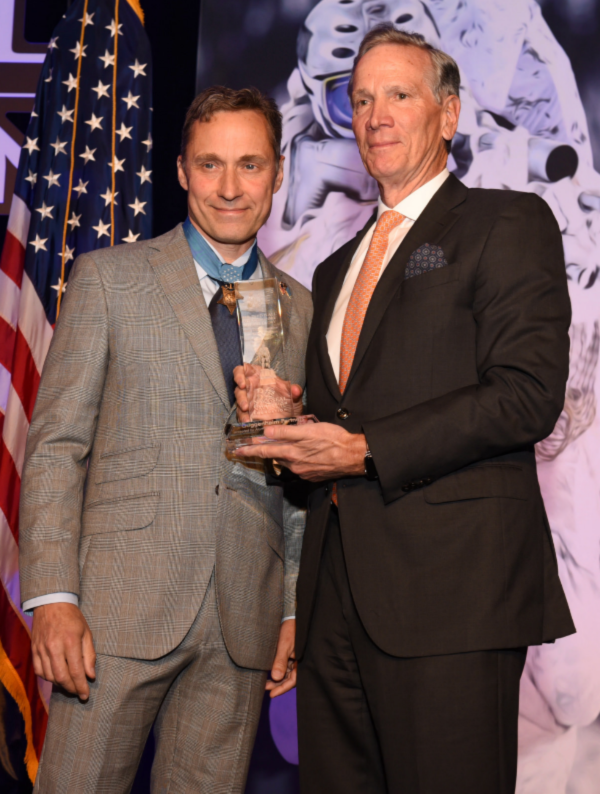 Retired SEAL and Medal of Honor Recipient Command Master Cheif Britt Slabinski presents Alan D. Schwartz with the Navy SEAL Foundation Patriot Award.