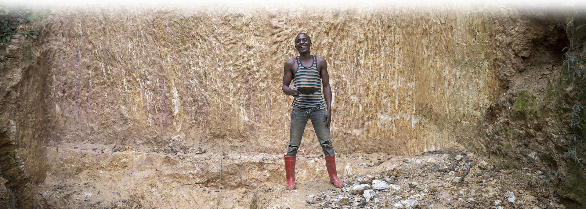 Miner in Red Boots, Photo: Sven Torfinn; courtesy, Impact.