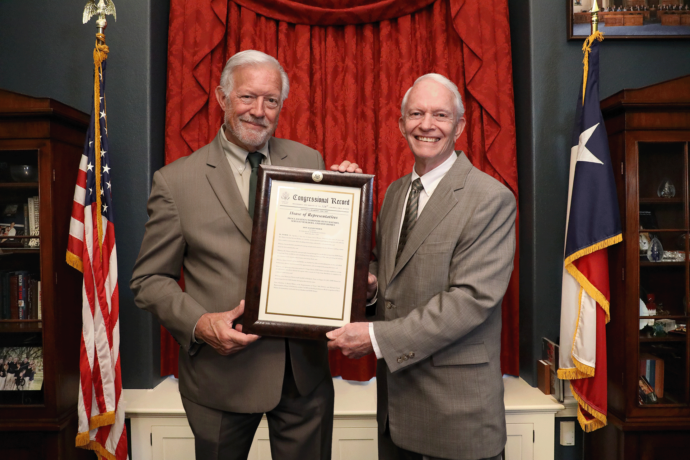 Texas Rep. Randy K. Weber presents a congressional recognition plaque to GrantWorks' founder and President Bruce J. Spitzengel.