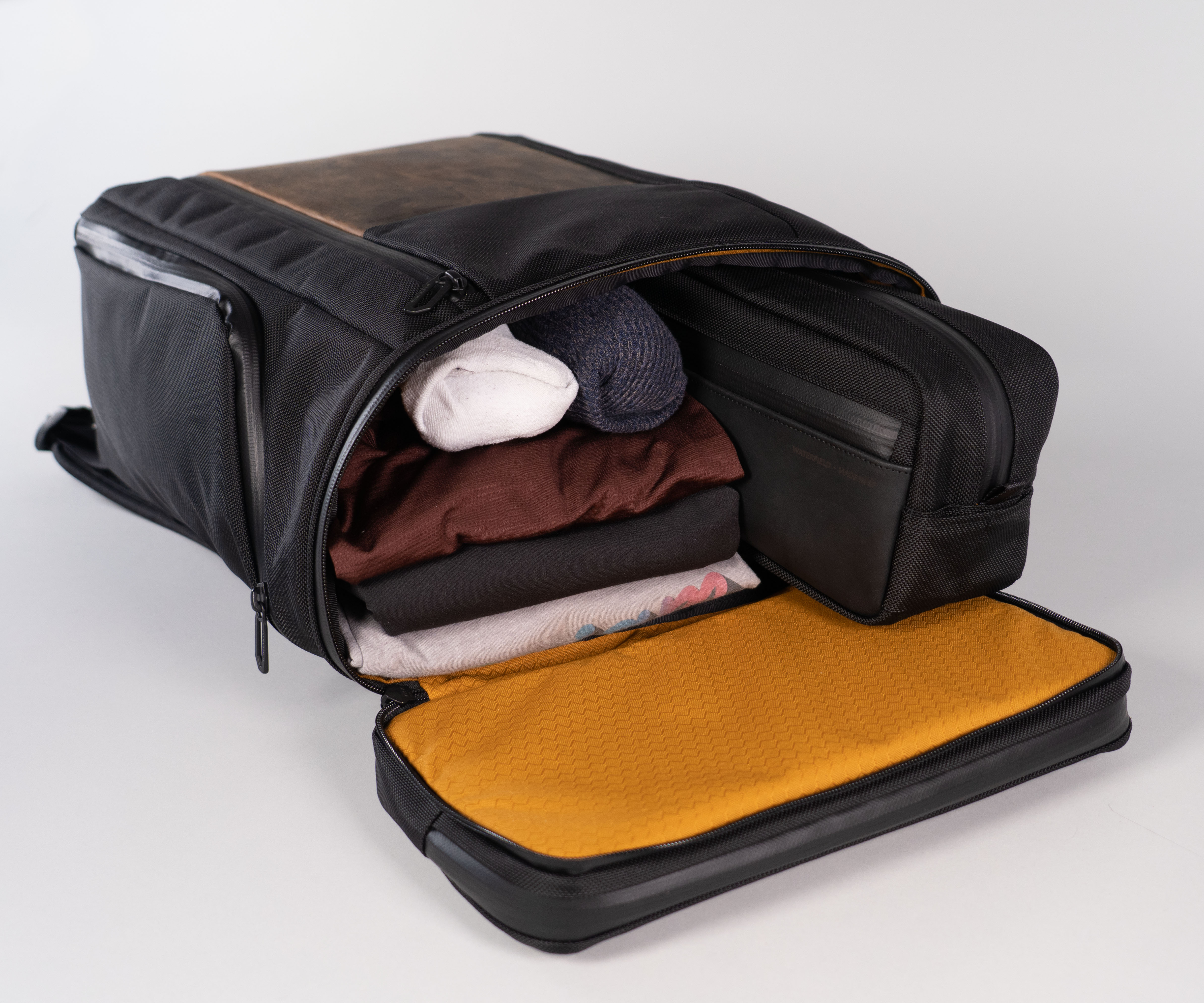 Main compartment fits a Travel Toiletry Bag, clothing, electronics