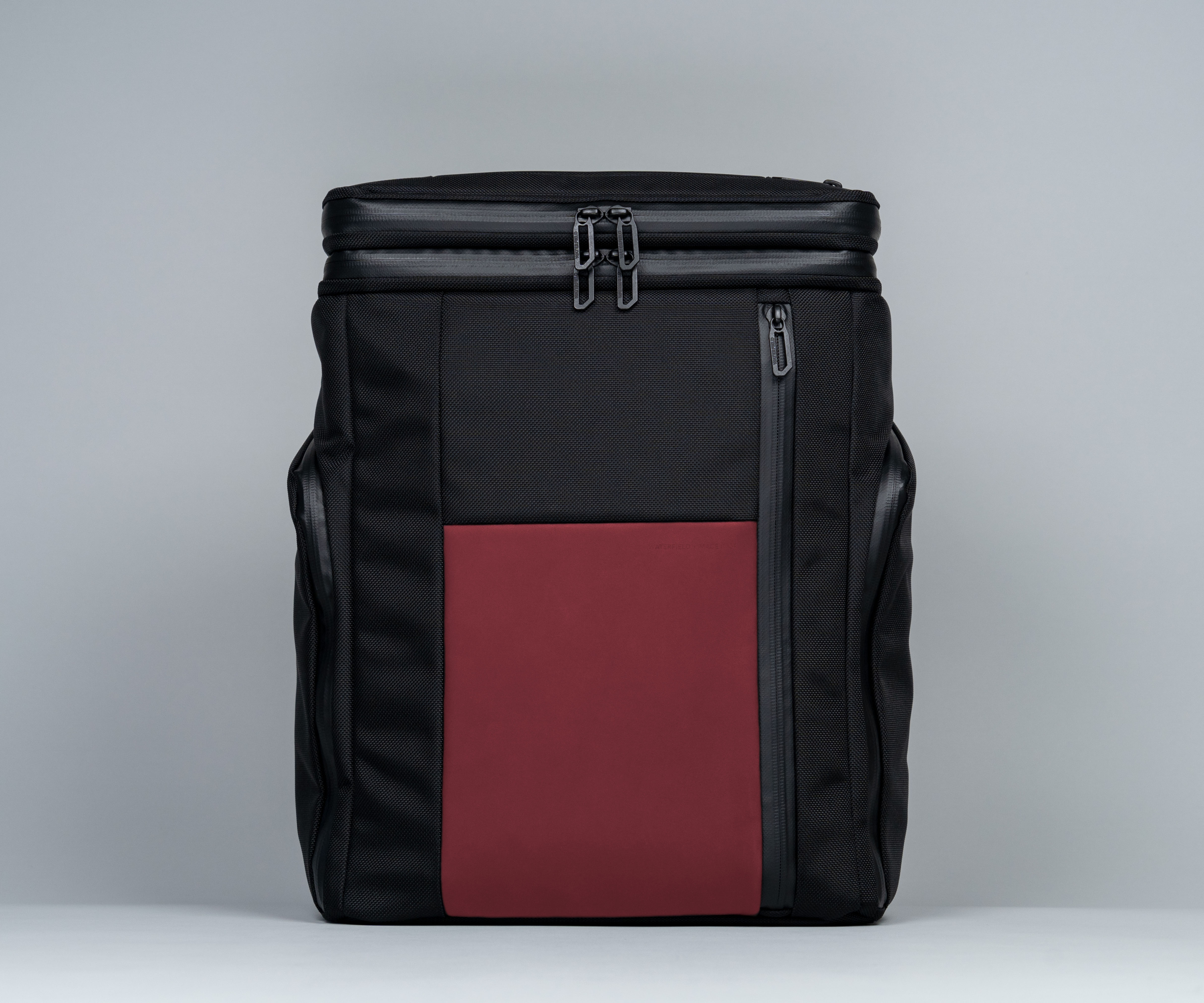 Air Porter Backpack in black ballistic nylon and crimson full-grain leather