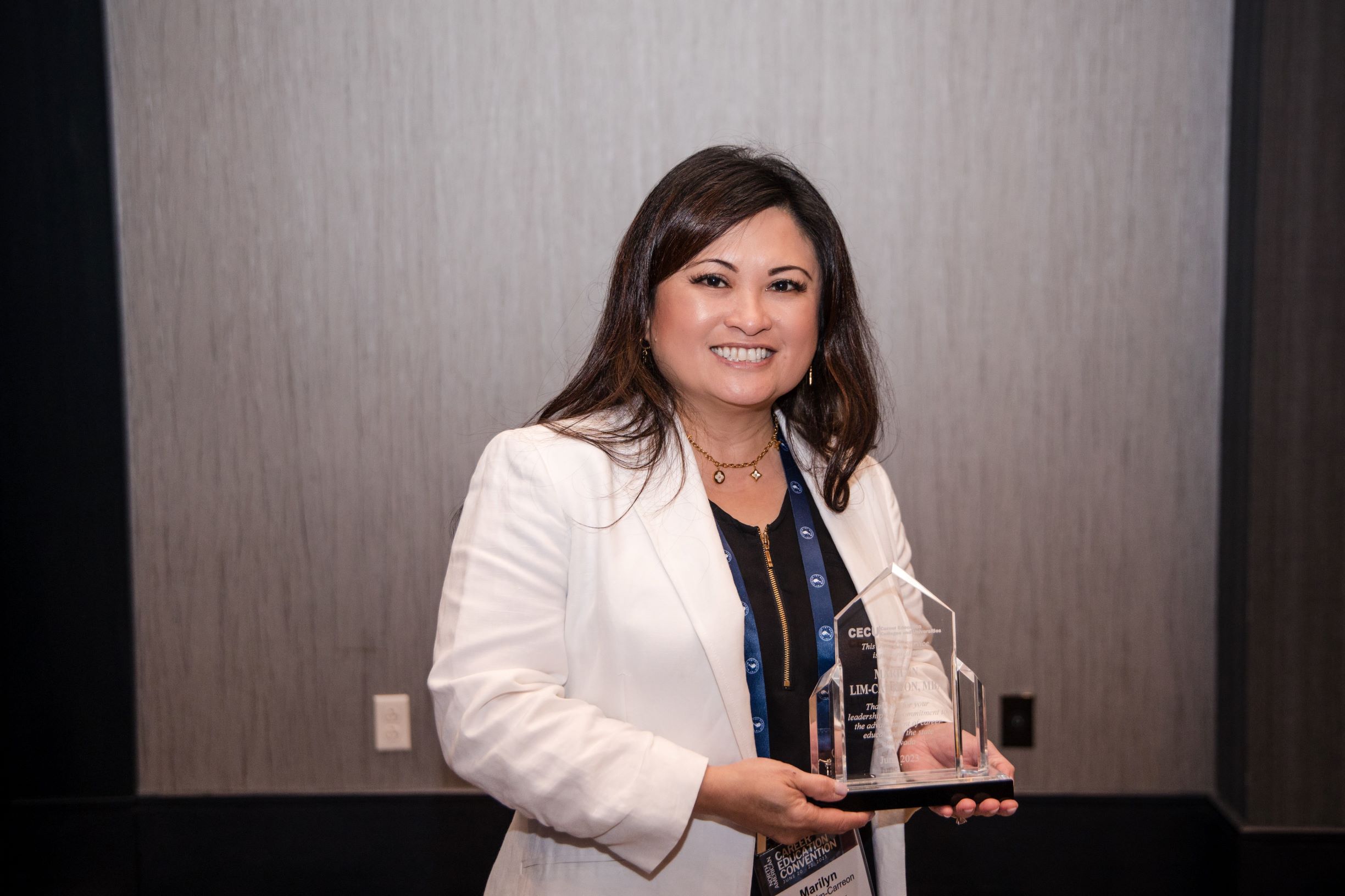 Marilyn Lim-Carreon with the CECU Leadership Award.
